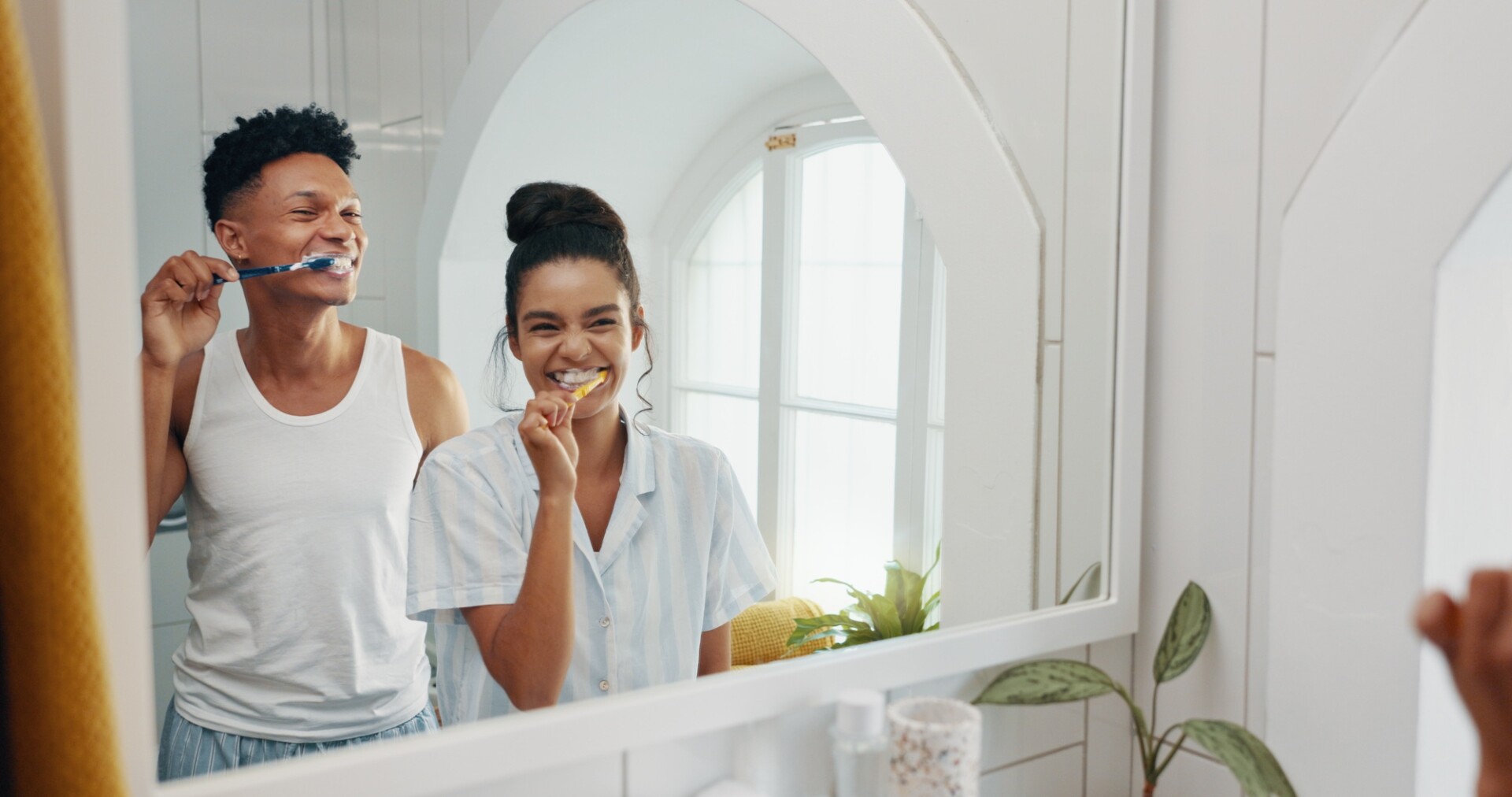 Brushing teeth, morning and reflection with couple in bathroom for dental hygiene or oral care. Hap